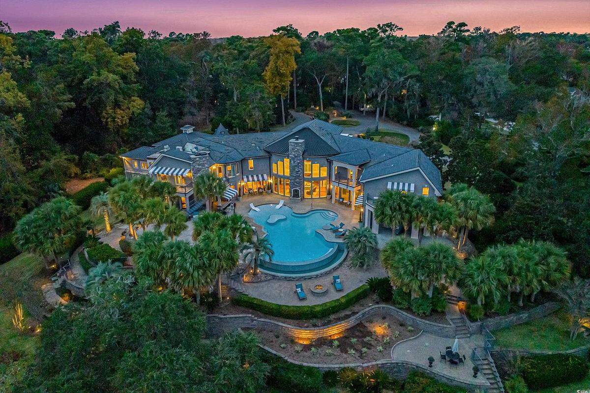 The view of the house and pool in the backyard.