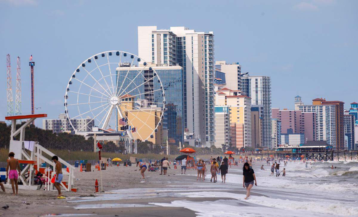 A view of the Sky Wheel in downtown Myrtle Beach from the ocean on July 4, 2024.
