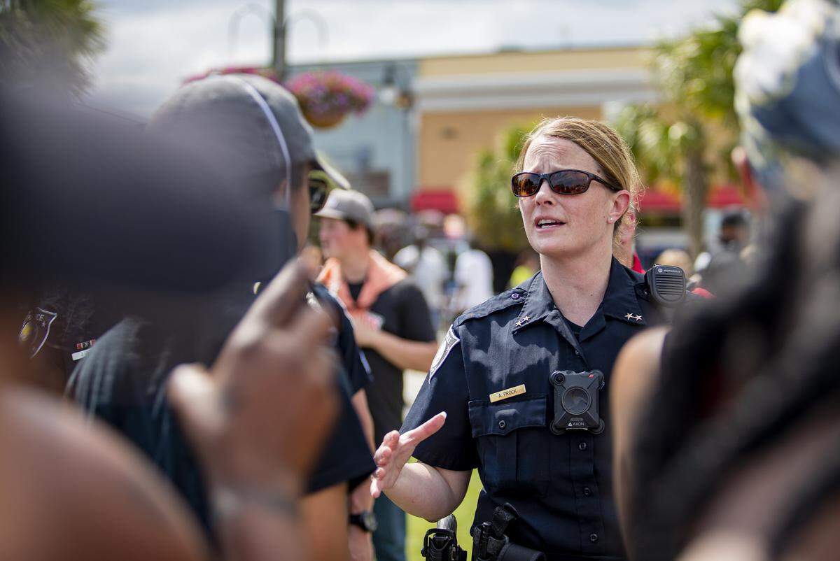 Myrtle Beach Police Chief Amy Prock speaks with protester Mia Angelo as crowds gather at Plyler Park in Myrtle Beach Sunday afternoon in response to the murder of George Floyd, who died at the hands of Minnesota police officer Derek Chauvin in Minneapolis, Minn. last week.