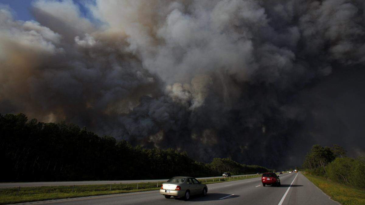 The 2009 wildfire in Horry County destroyed 70 homes and caused tens of millions of dollars worth of damage. Firefighters talk about it still. File photo.