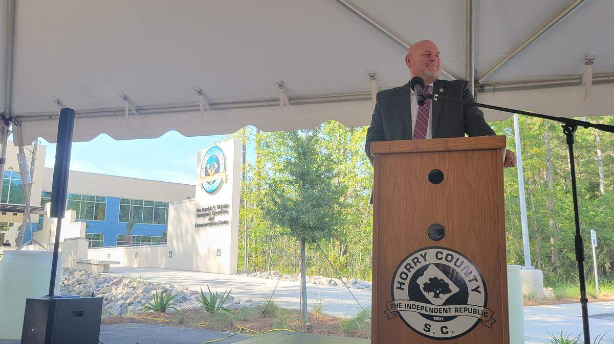 Horry County emergency management director Randall Webster becomes emotional while speaking Wednesday, Aug. 31, 2022 at the dedication ceremony for a new $24 million, 43,000-square-foot public operations center named in his honor.