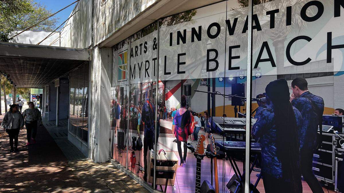 A window sign announces the new Arts & Innovation District in Myrtle Beach, S.C. Wednesday, April 24, 2024.