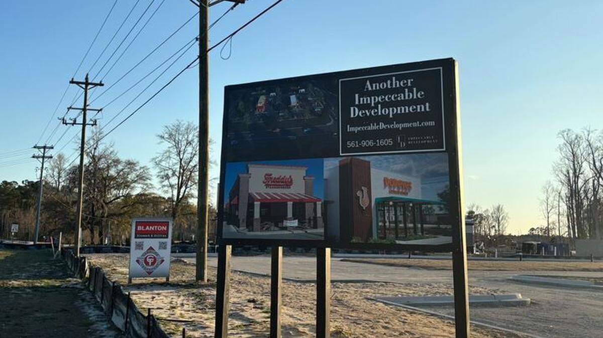 A sign advertises a new Popeyes and Freddy’s location in the Myrtle Beach, SC area. The restaurants will be built along S.C. 544.