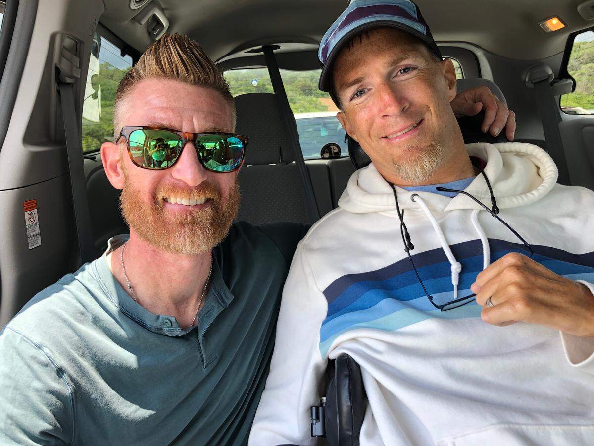 ESPN reporter Marty Smith (left) and Chris Skinner of Myrtle Beach during the filming of Smith’s feature on Skinner late last summer.