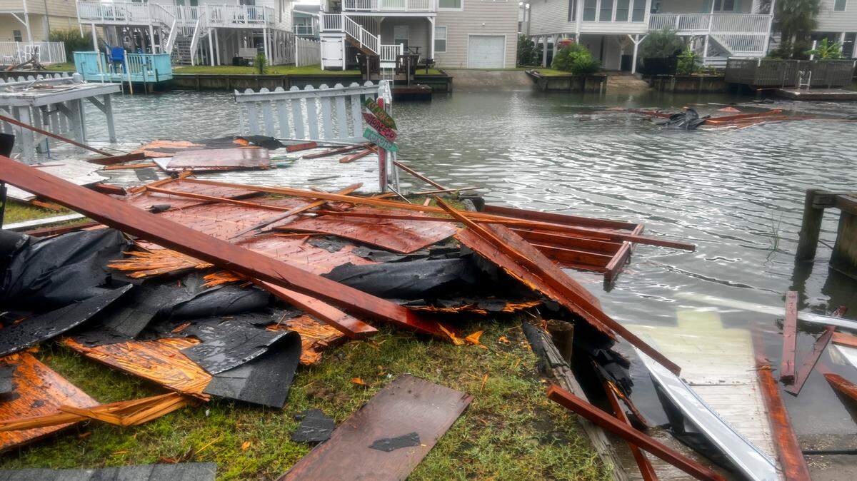Portions of a roof lay scattered in the canals of Hog Inlet in North Myrtle Beach S.C. after a tornado damaged roofs near 56th Avenue North in North Myrtle Beach, S.C. Hurricane Idalia was downgraded to a tropical storm after hitting the gulf coast of Florida on Wednesday but brought heavy rains, coastal flooding and tornados to the South Carolina coastline. Aug. 31, 2023.