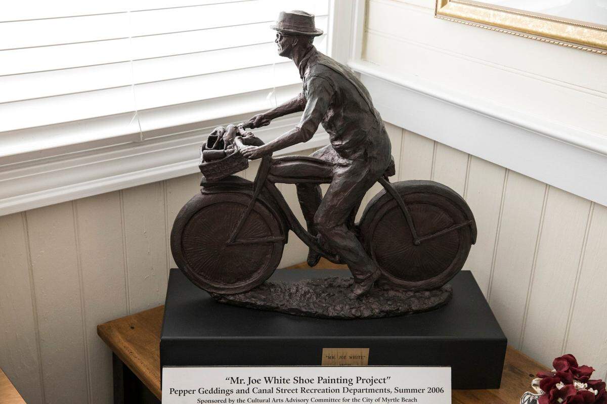 The Myrtle Beach Colored School Musuem has a scrapbook, statues, photographs and other artful tributes to Mr. Joe White. Mr. Joe White Boulevard is named for Joe White, a long term resident of Myrtle Beach who worked as a “shoe stylist” and rode his bike up 10th Avenue to work at Woody’s Barber Shop. Friday, Nov. 11, 2017.
