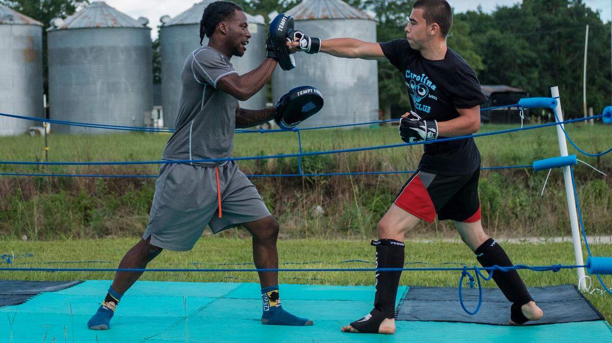 Nate Jenkins spars with Jeramiah “Jumbo” Ledesma in an Aynor back yard prior to boxing matches in 2020.