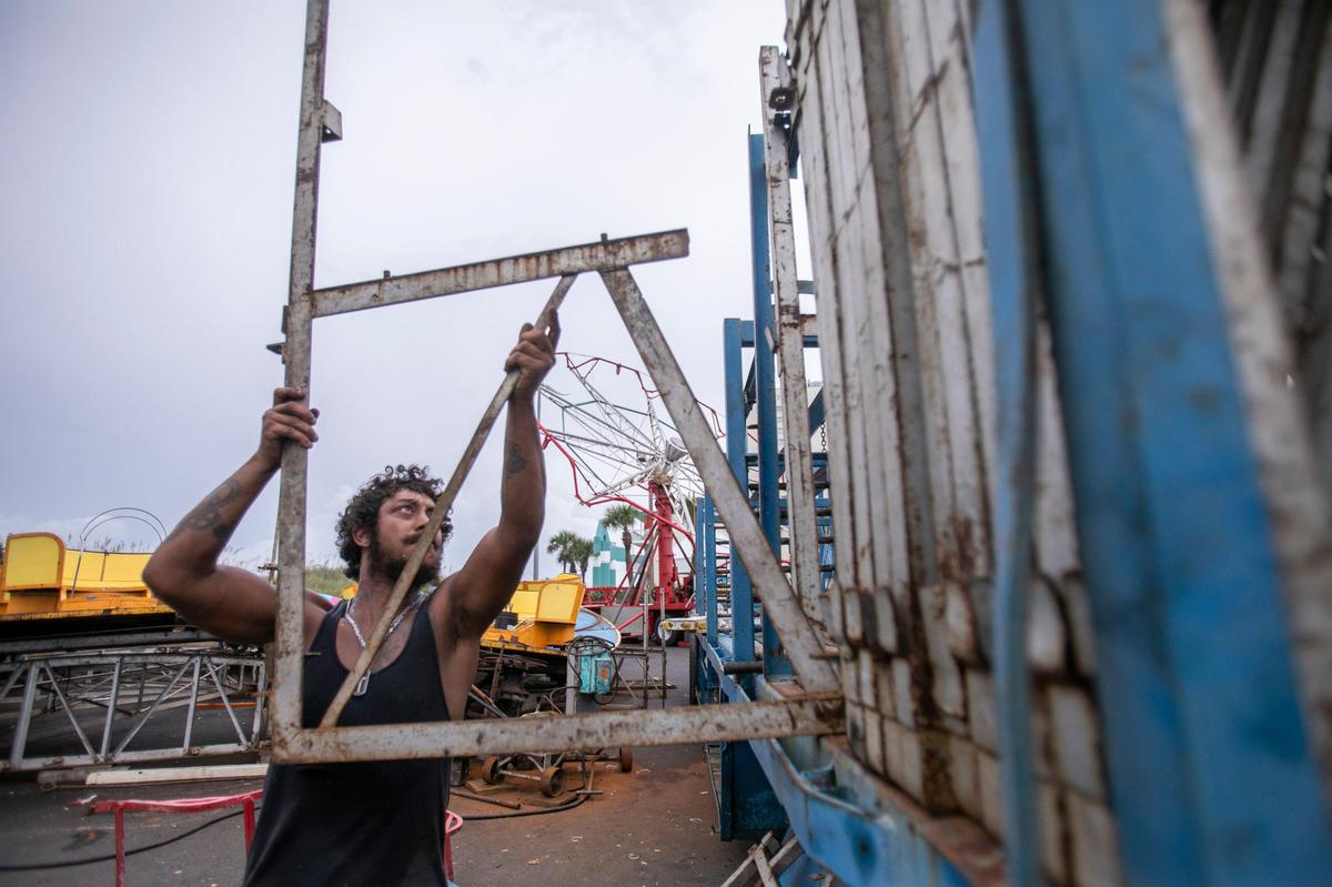 Joshua Jones helps to take down carnival ride equipment at the OD Pavilion in North Myrtle Beach prior to the arrival of Hurricane Dorian. Final preparations are being made in North Myrtle Beach for the arrival of Hurricane Dorian later today and through Thursday. Wednesday Sept. 04, 2019.