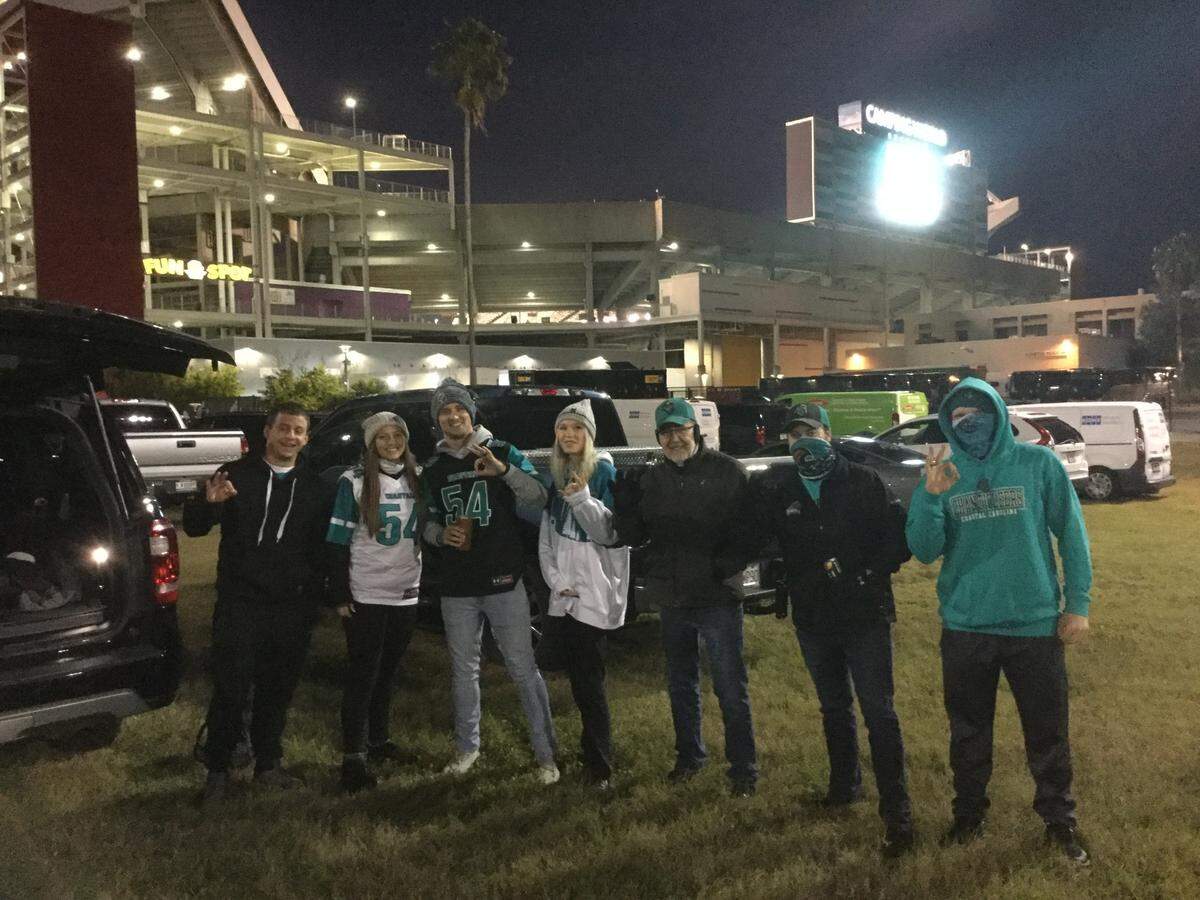 Stephanie and Trey White, second and third from left, are among a group of Coastal Carolina fans who made the trip to the FBC Cure Bowl in Orlando, Florida.