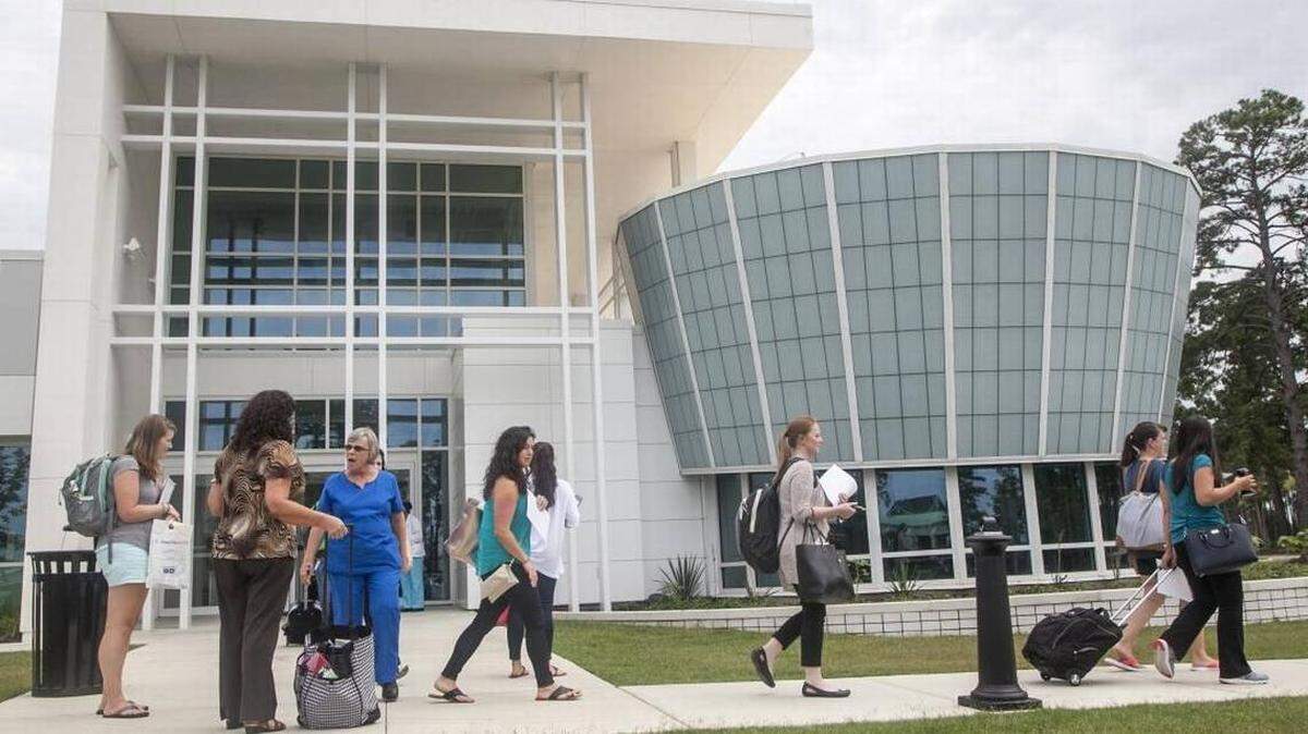 Pedestrians walk by HGTC’s International Culinary Institute of Myrtle Beach.