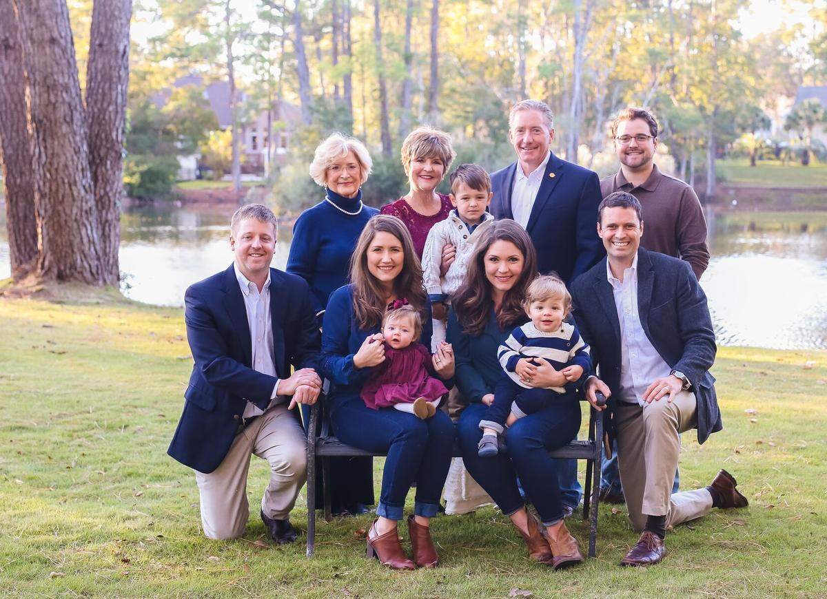 State Sen. Greg Hembree (top row, second from right) takes a family photo ahead of Thanksgiving 2018, just months after surviving a life-threatening brain injury and subsequent blood infection.