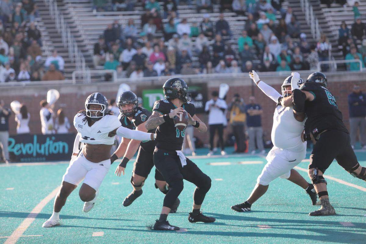Coastal Carolina quarterback Ethan Vasko looks to throw as the Georgia Southern defense pressures him. Vasko struggled to connect with his wide receivers, as the season-long struggle with dropped passes and incompletions continued.