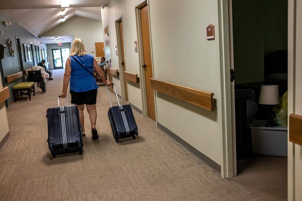 A family member removes the belongings of an elderly resident at the Oaks of Loris. Family members received a 30-day notice of the closure May 3, and the center is now working quickly to find licensed facilities to take them in. State health officials had revoked their license despite new ownerships hopes of keeping the Loris facility open. May 10, 2023.