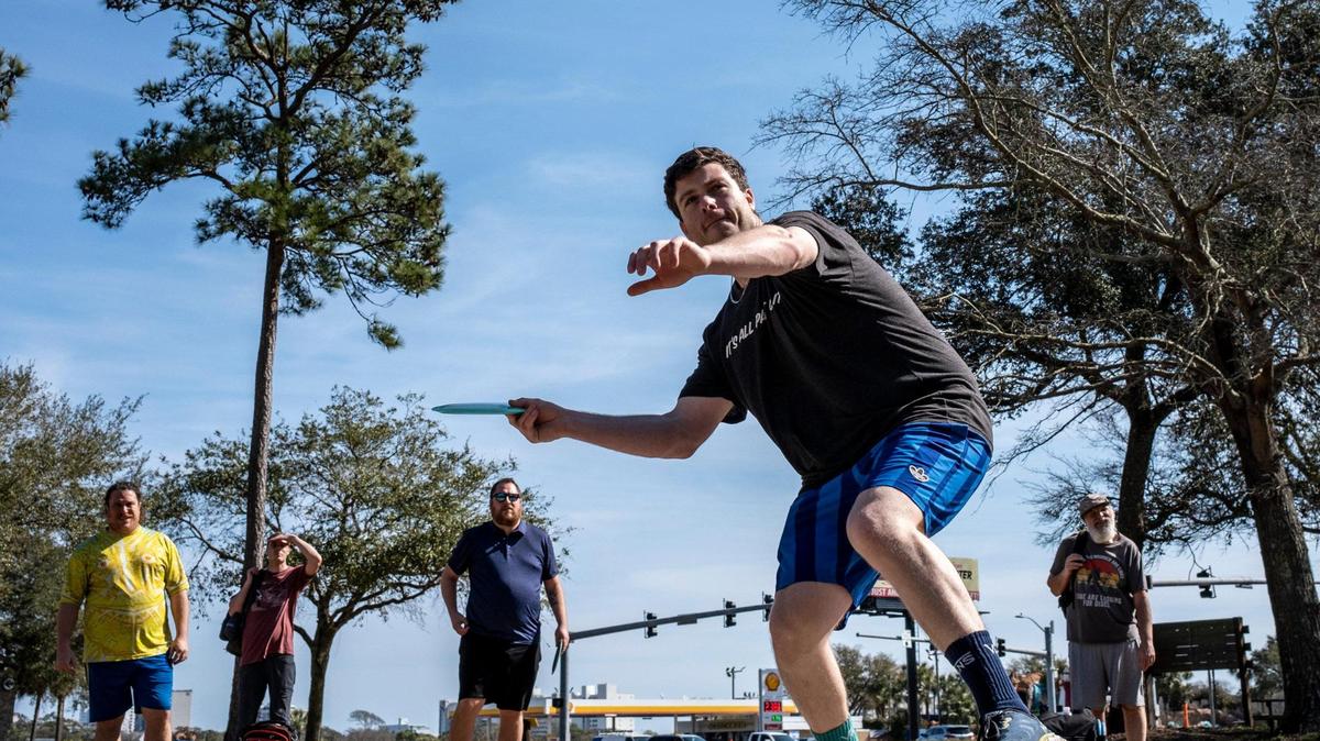 Chris Kies launches a disc from a tee pad at Myrtle Beach’s Splinter City on Wednesday. Disc golfers play at Splinter City, an 18 hole park in the Market Common District of Myrtle Beach, S.C.. February 15, 2023.