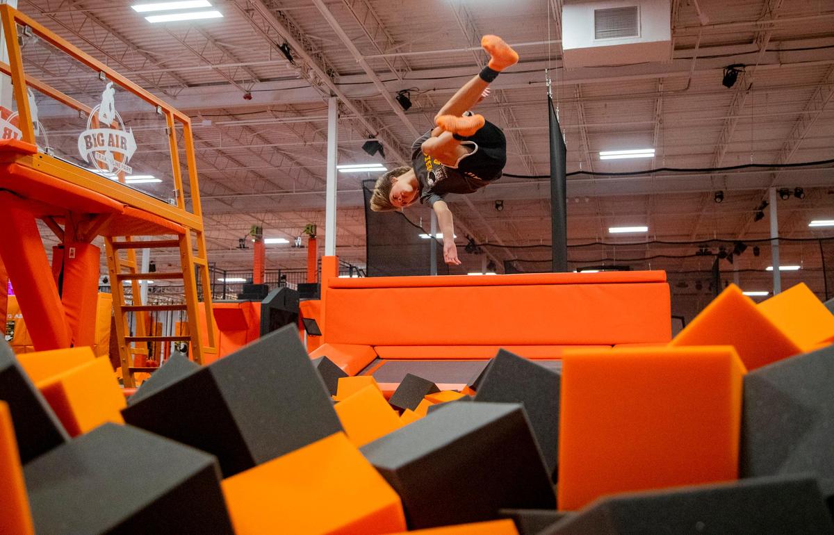 A.J. Pelletier, 13, dives into a foam pit at Big Air, a new trampoline park opening near the Market Common in Myrtle Beach.