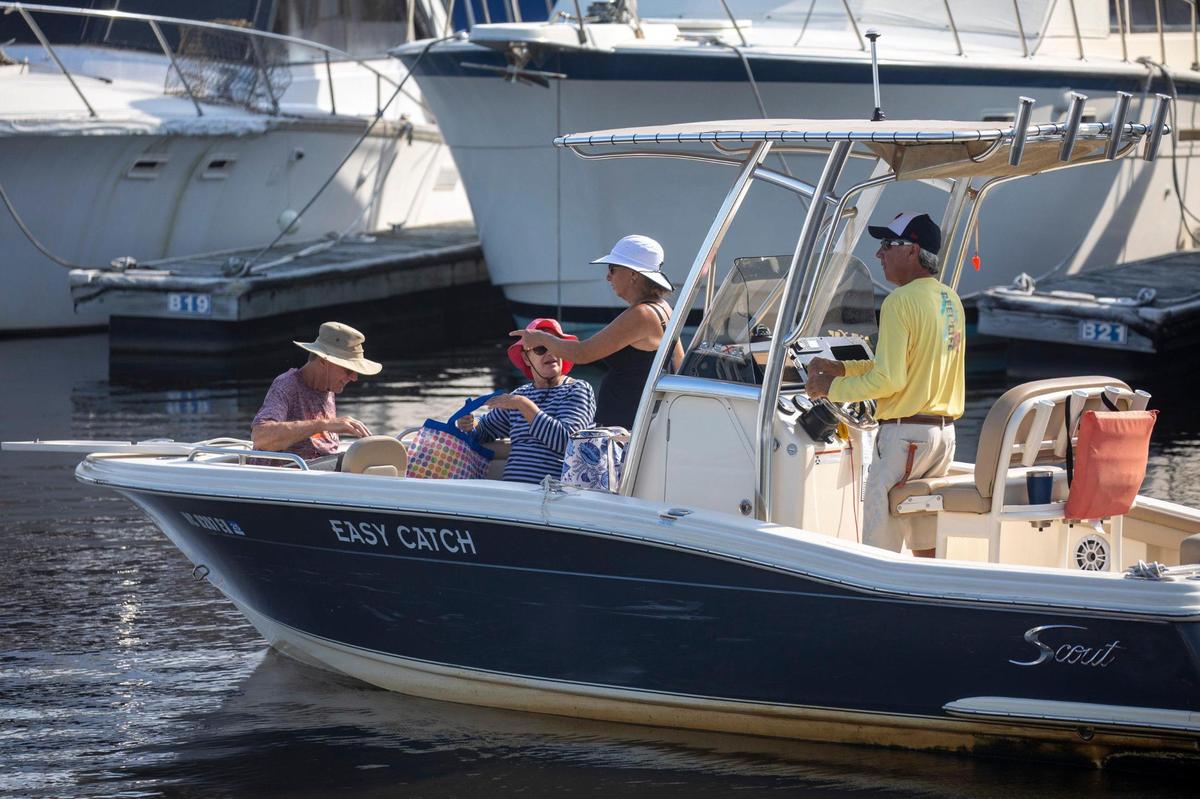 Members of Freedom Boat club load up at Harbourgate marina for a day on the water in North Myrtle Beach. The boat club, which maintains a fleet of vessels in three Myrtle Beach area locations, has experienced record membership growth due in part to low dealer inventories and post-pandemic interest in boating. Aug. 3, 2022.