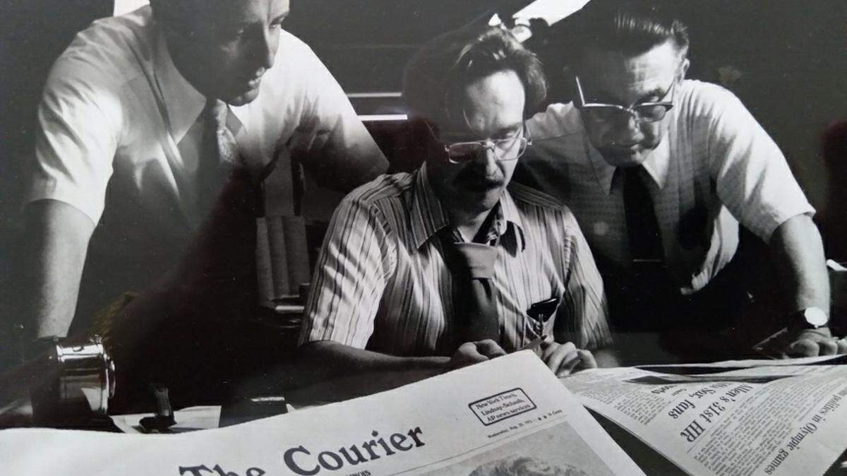 George Willhite (left), D.G. Schumacher (middle), and Bill Judy (right), in The Courier newsroom, Urbana, Illinois, in August 1972.