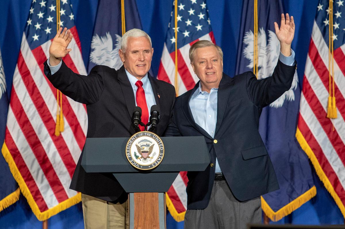 Vice President Mike Pence waves to supporters with South Carolina Senator Lindsey Graham at the Embassy Suites at Kingston Plantation in Myrtle Beach. Pence was in town along with South Carolina Governor Henry McMaster and Congressman Tom Rice to voice support for Senator Graham in his re-election bid.