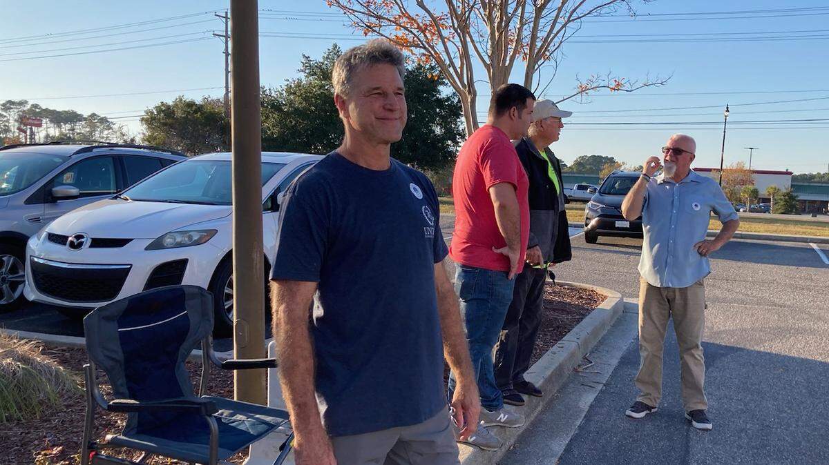Surfside Beach mayoral candidate Rob Krouse (left) stands outside the Dick M. Johnson Civic Center polling location Tuesday, Nov. 7, 2023.