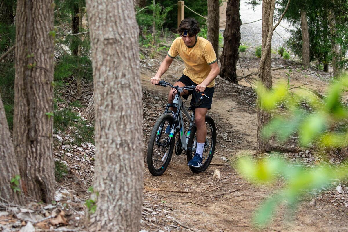 Patrick Wunderlich, a Coker College student on furlough, rides his bike along the trails of The Hulk, an Horry County Bike and Run Park. Locals and visitors are finding outdoor activities to help cope with the stress of the coronavirus. March 22, 2020.
