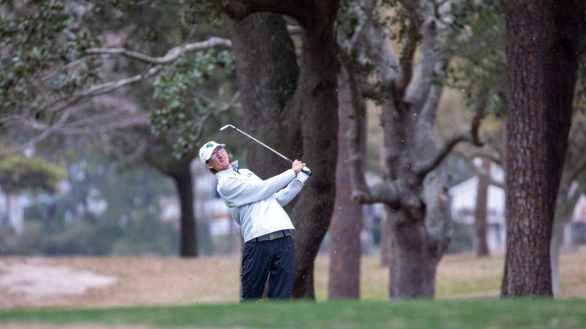 Coastal Carolina’s Seth Taylor makes his approach to the 18th hole at The Dunes Golf & Beach Club on Monday in the VI Sports General Hackler Championship golf tournament in Myrtle Beach, S.C. March 15, 2021.