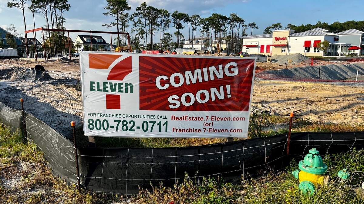 A new 7-Eleven is opening in Myrtle Beach. No construction has begun, but a sign sits in front of the eventual site.