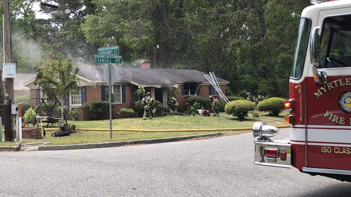 Firefighters from Myrtle Beach Fire Rescue respond to a fire at 1313 Hemingway Street in Myrtle Beach on Sunday.