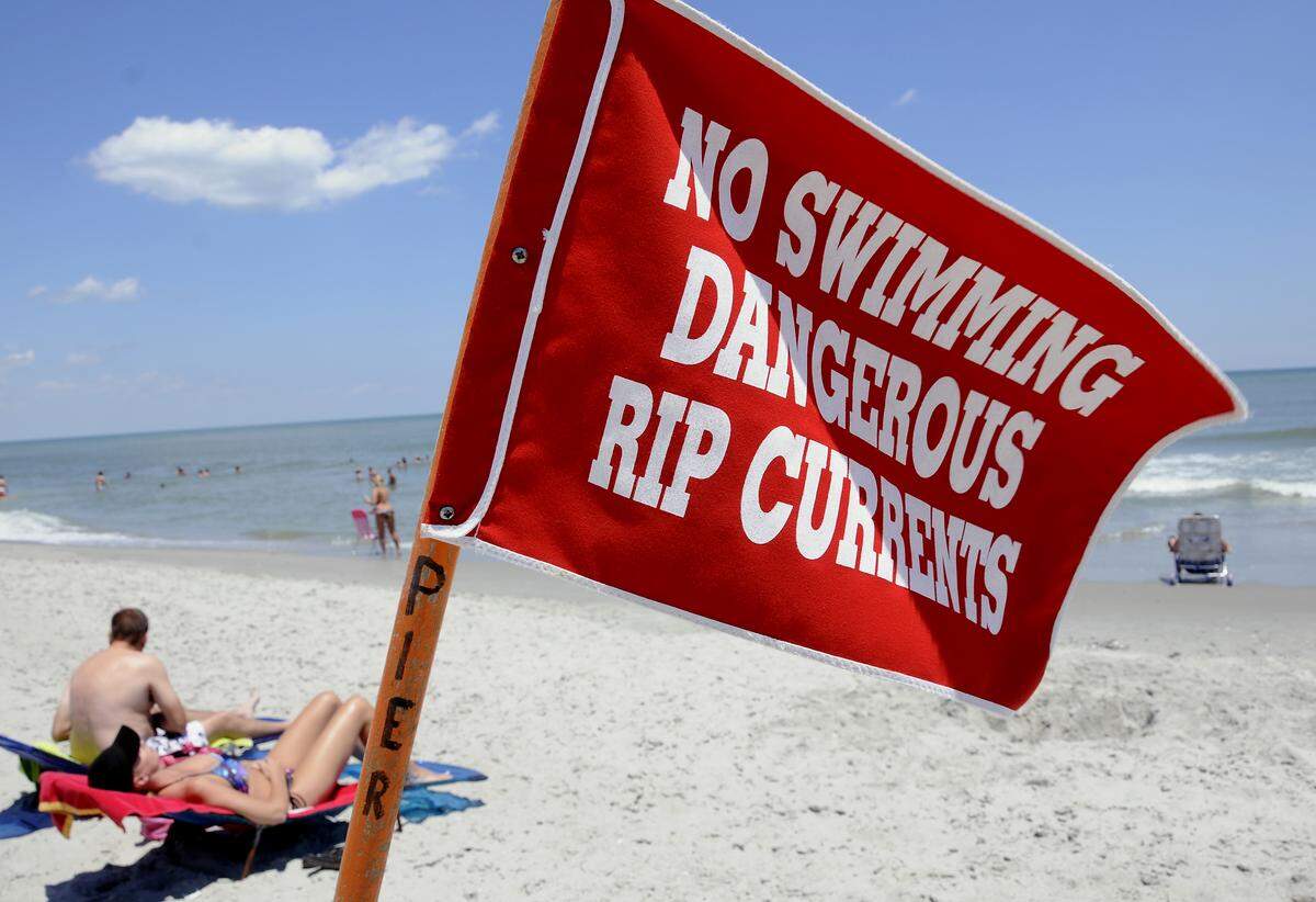 Beach communities along the North Carolina coast use a color coded flag system developed more than two decades ago by the National Weather Service, NOAA and the U.S. Lifesaving Association to quickly convey information about hazards on the shore.