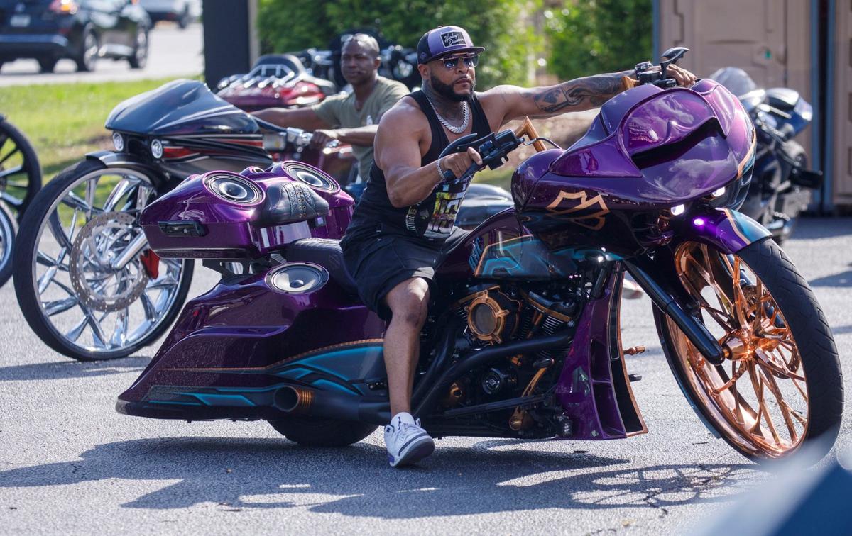 Chris Coleman from Albany, New York displays his custom Harley-Davidson creation outside of Hooters at the Myrtle Beach Mall on Friday. The 2024 Black Pearl Cultural Heritage and Bike Festival, also known as Black Bike Week, came roaring into the Northern end of the Grand Strand Friday night. Bikers gathered at the Myrtle Beach Mall to show off their rides, cruised through Atlantic Beach, and partied under beach houses in North Myrtle Beach. S.C. May 24, 2024.