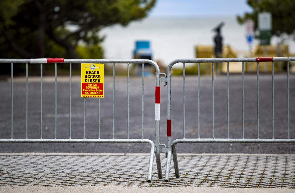 Barriers block off beach access along Ocean Boulevard Wednesday afternoon after South Carolina Gov. Henry McMaster issued an executive order on Monday that closes all public access points to the state’s beaches.
