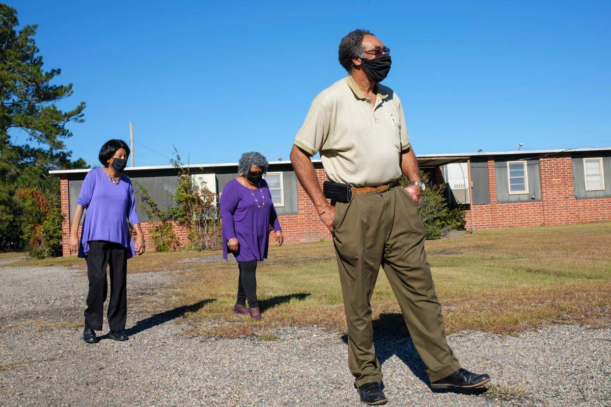 Reverend Jerry Faulk, along Genar Faulk and Edna Dewitt, all former students of Whittemore Elementary, walk the campus weeks after Conway officials announced that the historically Black 1950’s era “equalization school,” would likely need to be demolished due the high cost of repair. Many former students say the building is an important part of the communities heritage that should be saved. Nov. 9, 2021.