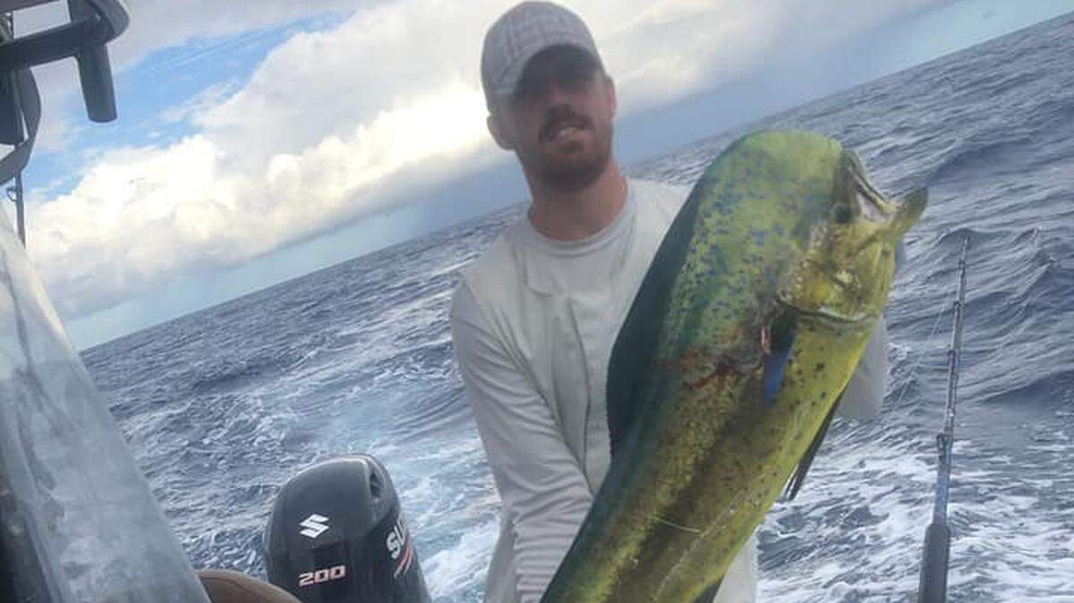 Ronald Stalvey III of Conway shows off a 30-pound dolphin caught near The Steeples on a fishing trip Wednesday, May 8, 2019.