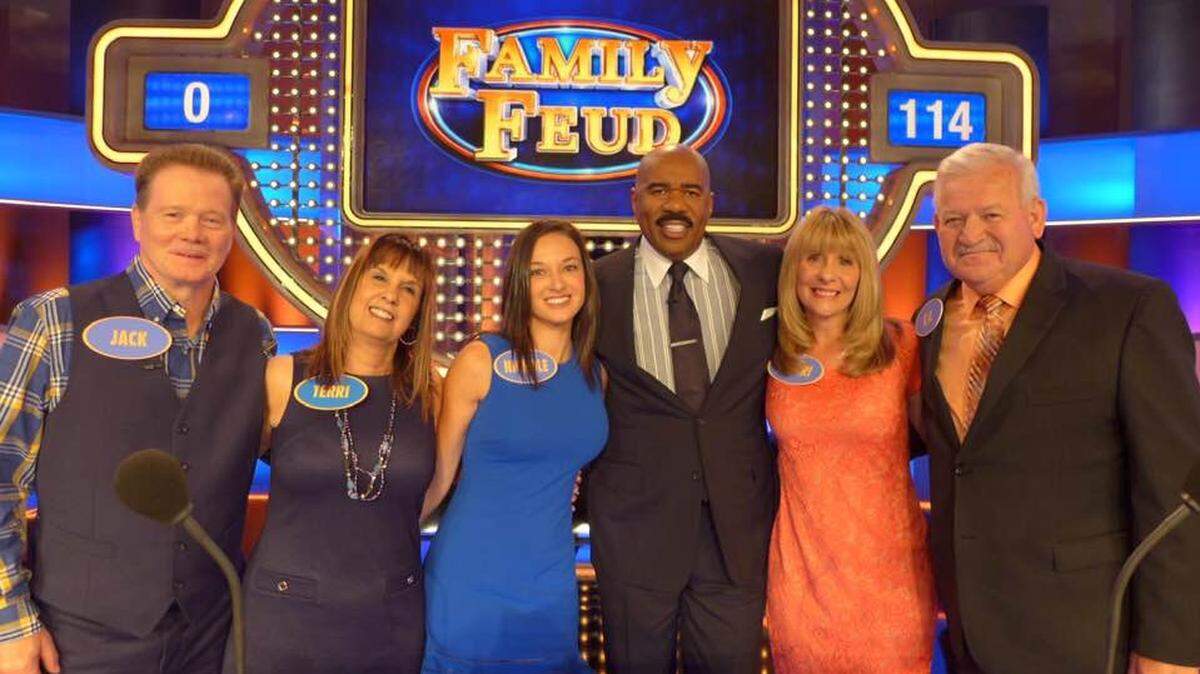 Jack Dempsey, from left to right, Terri Ann Dempsey, Leslie Nichole Bohannon, host Steve Harvey, Sherri Lynn Damron and K.O. Damron pose for a picture during the filming of a Family Feud episode set to air Monday night.