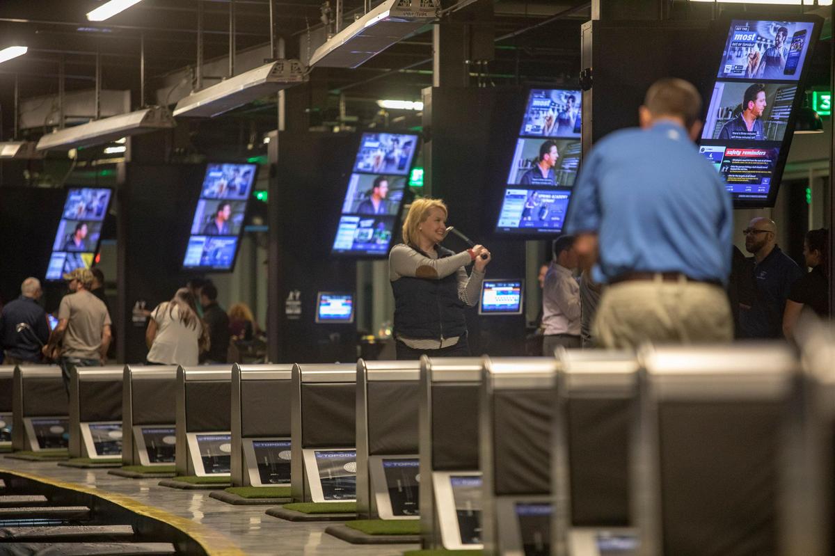 Patrons drive golf balls on the third floor of the new Topgolf Myrtle Beach. The media was given a tour and preview Wednesday of the facility, which will open in the coming weeks on the corner of Robert Grissom Parkway and 29th Ave. North in Myrtle Beach, S.C.