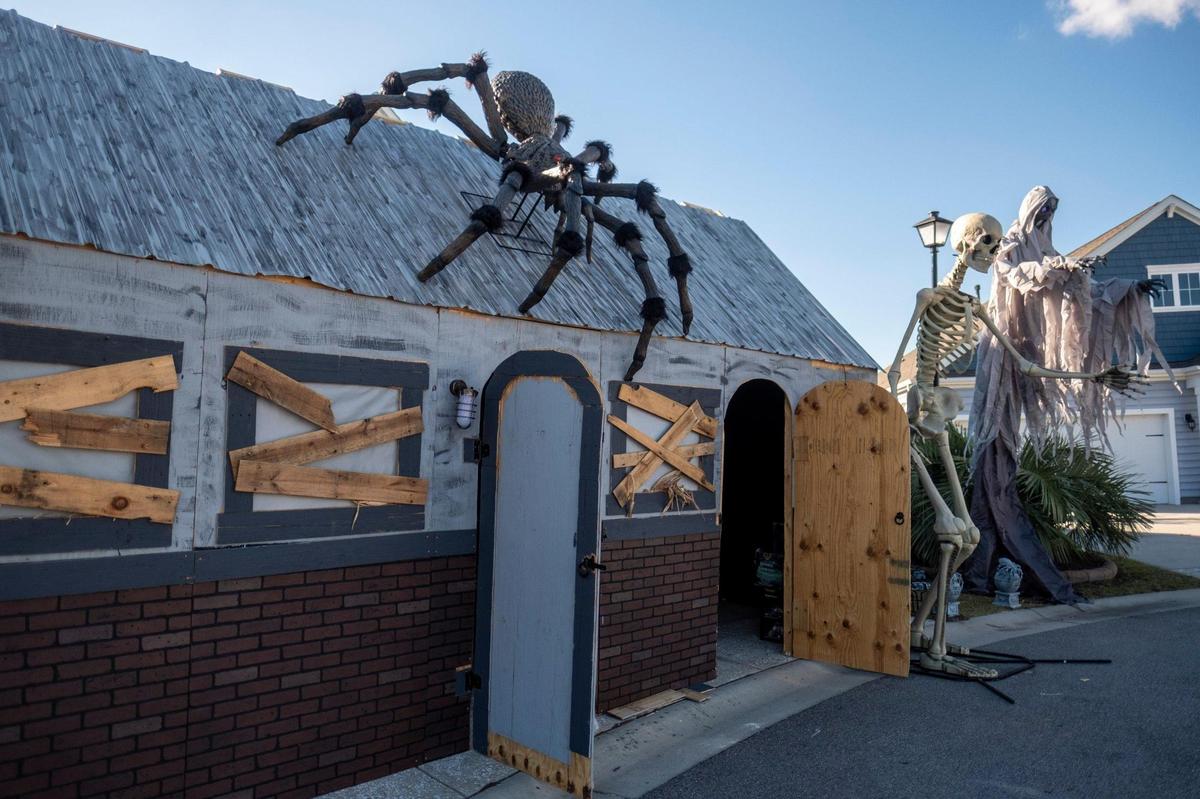 Randy Dorebos works to build a haunted house in his The Farm at Carolina Forest neighborhood on Thursday, Oct. 20, 2022. The shocking displays, which often feature neighbors in costume and make-up, have become popular draw for visitors from around the area. From fun and quirky decorations to down right scary haunted houses, around Horry County residents are preparing for Halloween 2022. October 20, 2022.