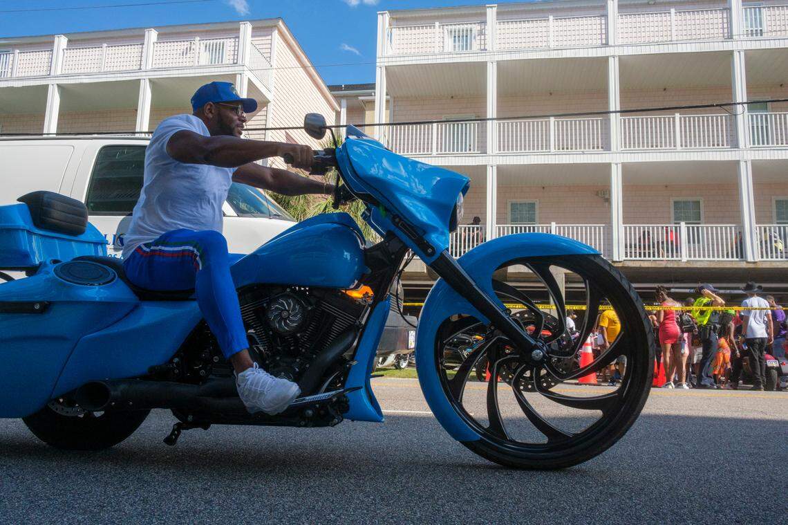 Bikers cruise Ocean Boulevard in North Myrtle Beach by a large house party hosted by the Tru Ikonz Motorcyle Club on Friday. May 23, 2025.