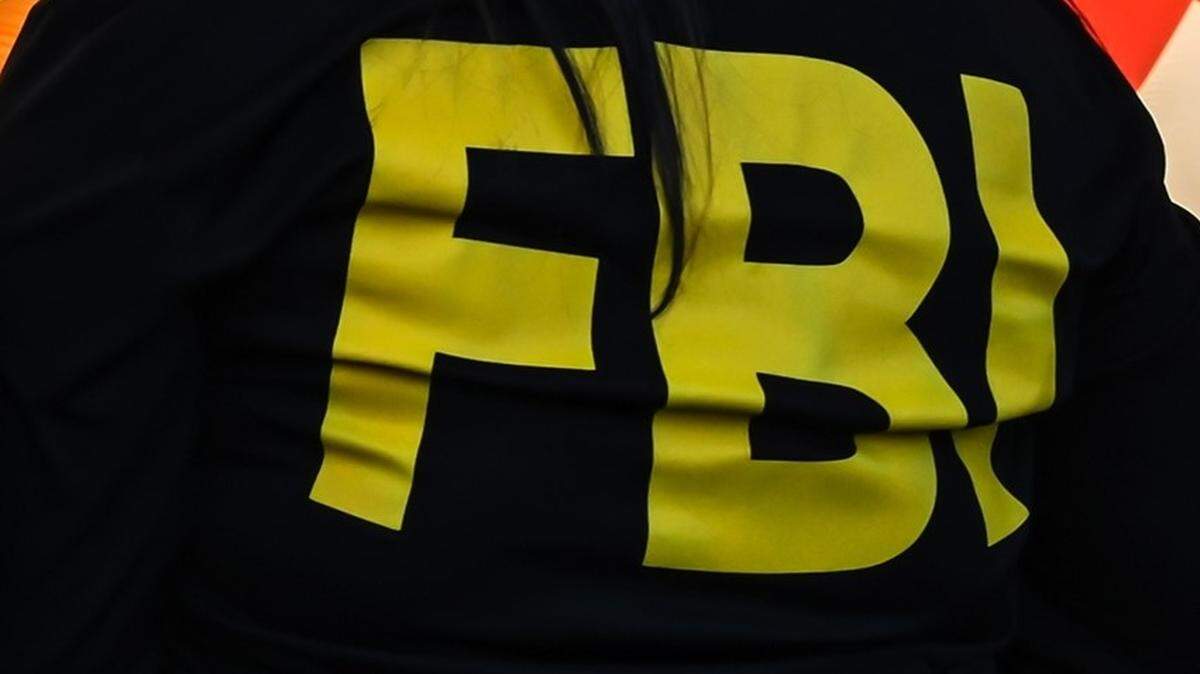 FBI agents are at the home of a Conway couple who were arrested for using racial slurs and burning a cross in front of their Black neighbors’ home over Thanksgiving weekend.