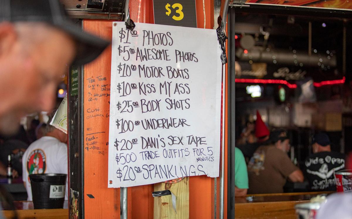 A signs advertises services offered by bartenders at Suck Bang Blow Friday afternoon during Bike Week in Murrells Inlet.