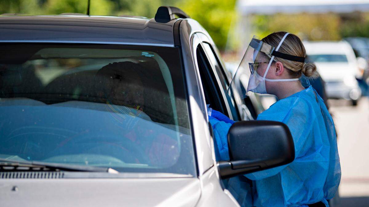 Tidelands Health medical professionals conduct a drive-through COVID-19 testing site Friday morning at Myrtle Beach Pelicans Ballpark. At least 63,880 people have tested positive for the coronavirus in South Carolina, and 1,053 have died, according to state health officials. Public health officials reported 1,842 new confirmed COVID-19 cases and 69 new confirmed deaths from the virus Thursday, the highest single-day death total DHEC has recorded since the pandemic began.