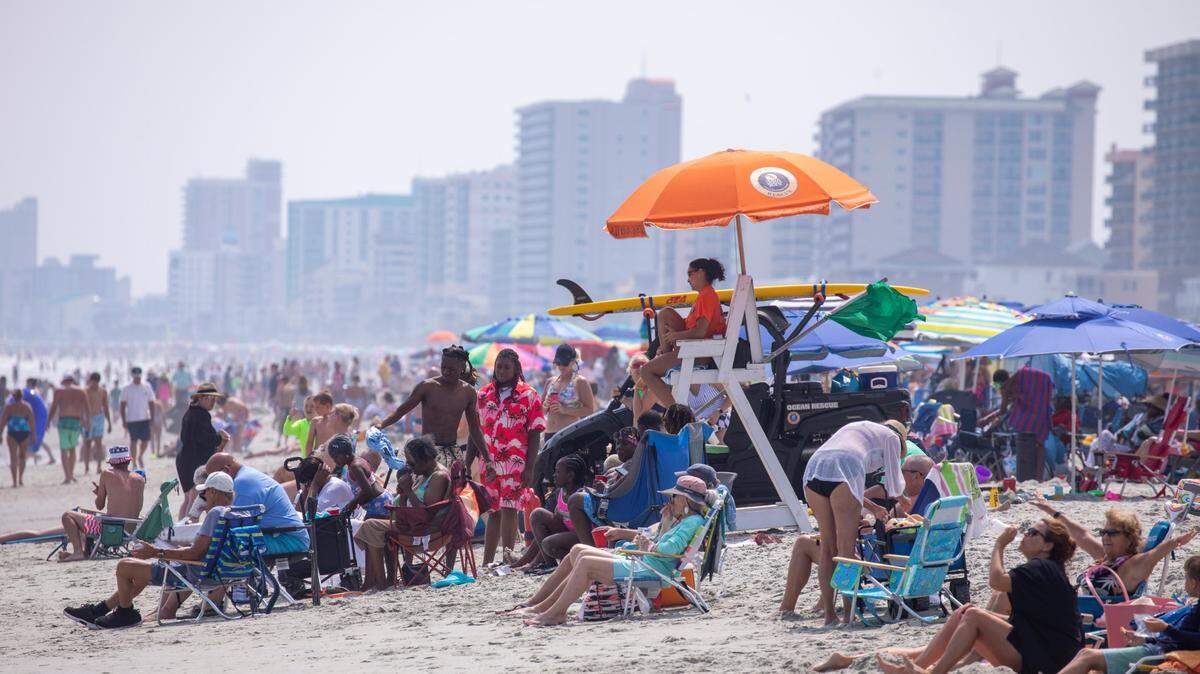 Crowds of tourists pack North Myrtle Beach despite hazy and hot condition . June 9, 2023.
