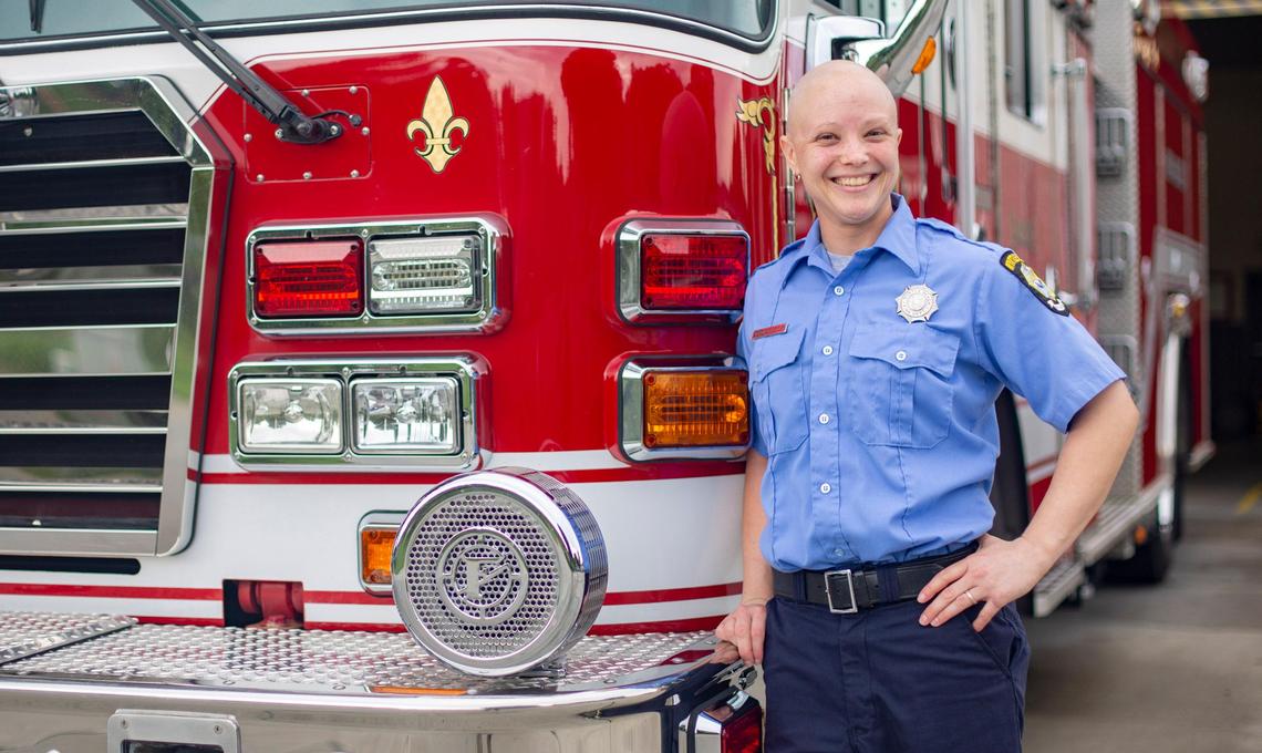 Myrtle Beach firefigher Jennifer Gilbert stands next to a fire engine at Myrtle Beach Fire Station 1 on Tuesday.