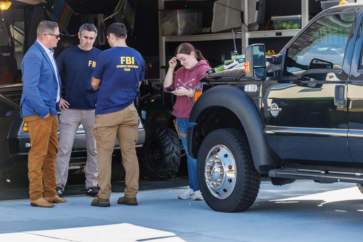 FBI agents at the home of former Solid Rock Church pastor John Paul Miller in November 2024. 