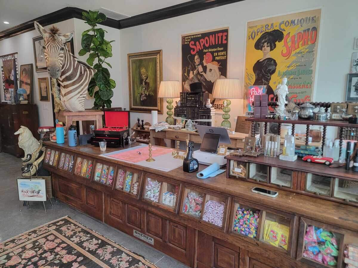 Room Service customers checkout at an antique counter.