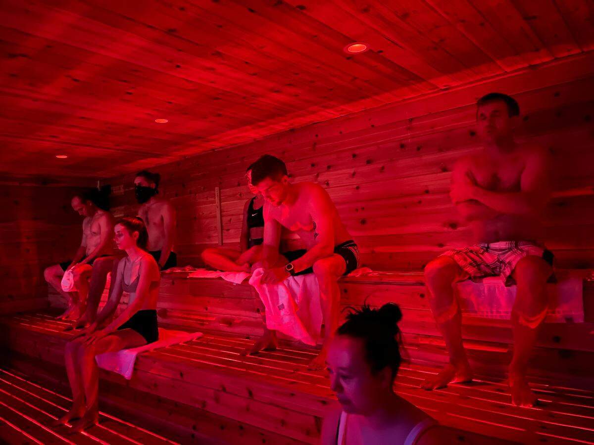 Visitors to MindZero (including the author in the foreground) practice breathing exercises in the 185 degree sauna. The MINDZERO sauna and cold plunge experience is located across the road from the Myrtle Beach State Park. January 6, 2022.