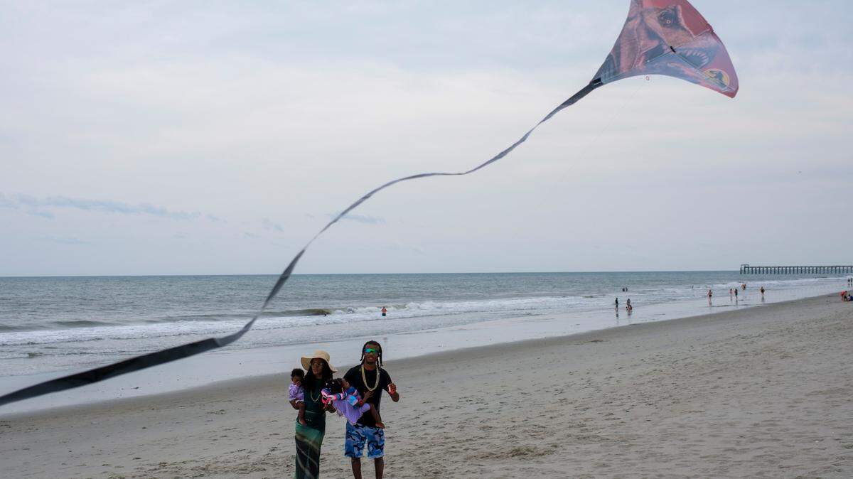 The Trumble family from Baton Rouge, La fly kites. Friday, May 30, 2025.