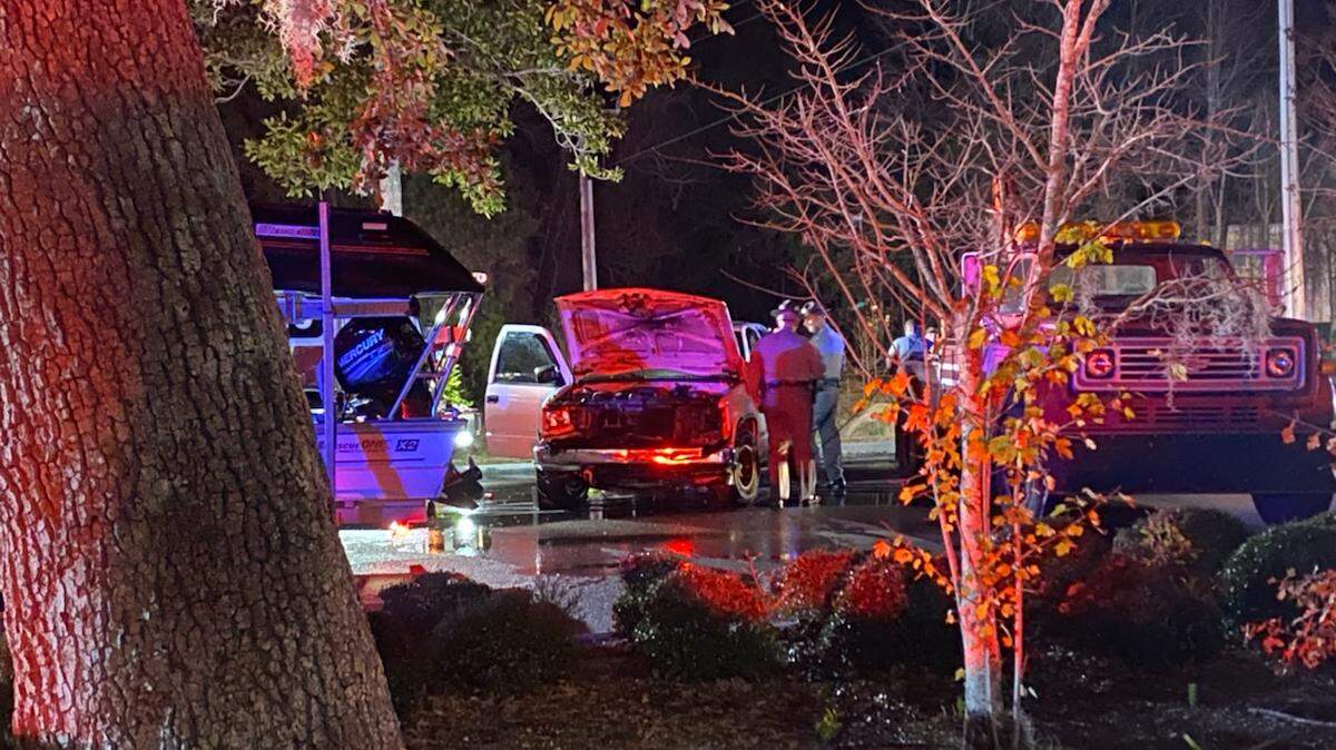 A truck sits idle after authorities pulled it from a retention pond on Christmas Eve.