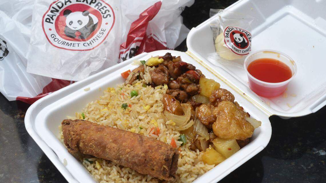 Panda Express Kung Pao Chicken, Sweetfire Chicken, with fried rice, an egg roll, sweet and sour sauce and a fortune cookie wrapped in plastic.
