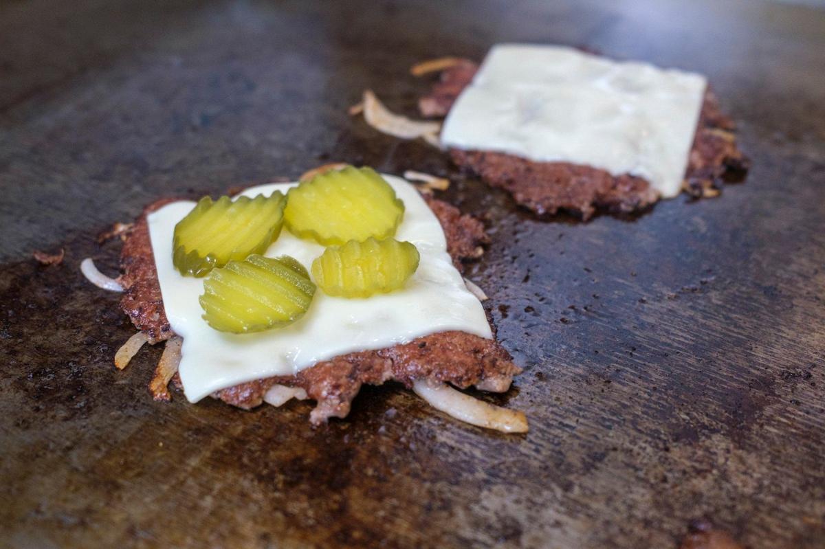 Mike Hensley opened Project Smashburger, a new food truck in Conway, earlier in July and has been met with rave reviews and increasing popularity. He serves smash burgers and loaded fries, usually from the parking lot of Rob’s Auto Body. July 18, 2024.