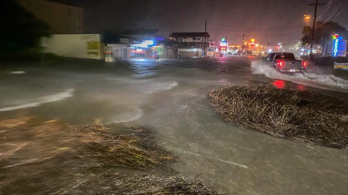 Sea Mountain Highway in the Cherry Grove section of North Myrtle Beach, along with many side streets around Hog Inlet, flooded during from a combination of Tropical Storm Isaias' onshore winds and a king tide. Arriving with a king tide, the coastal communities along the Grand Strand were flooding Monday night. August 3, 2020.