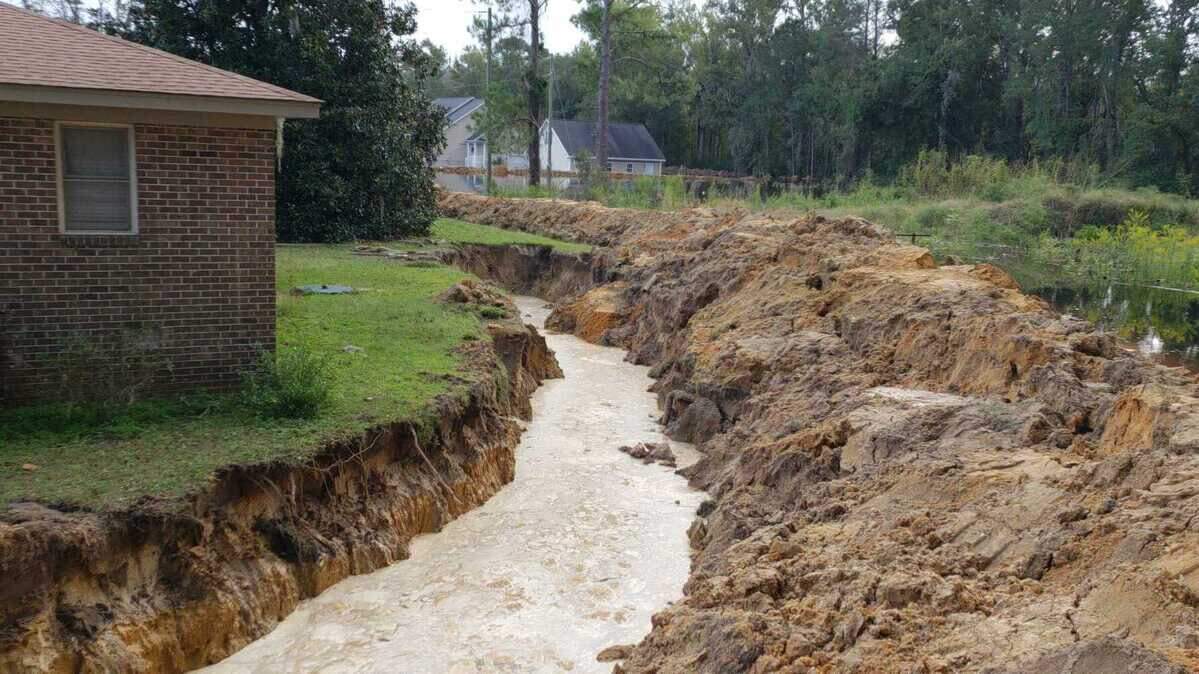 Neighbors near Peachtree Landing in Socastee built a 12-foot moat around their houses to try to prevent floodwaters from the nearby Waccamaw River from causing damage.